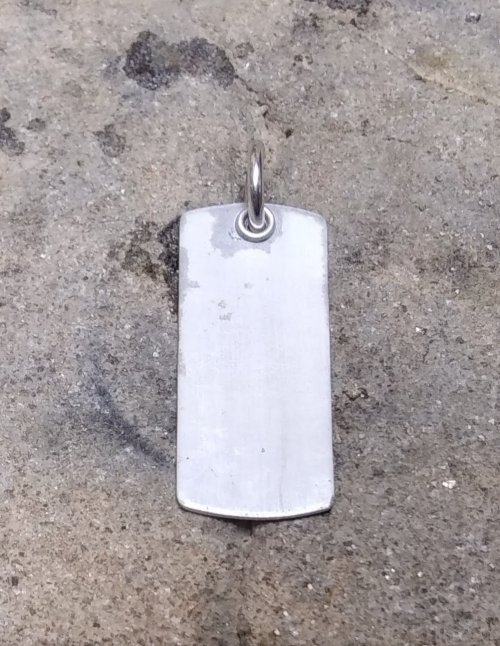 Judy Larson's Dog Tag Style Necklace - , Metalwork, How To Punch Holes, Hole Punching, Punch A Hole, Place the tag right side up on a magnesia soldering block.
